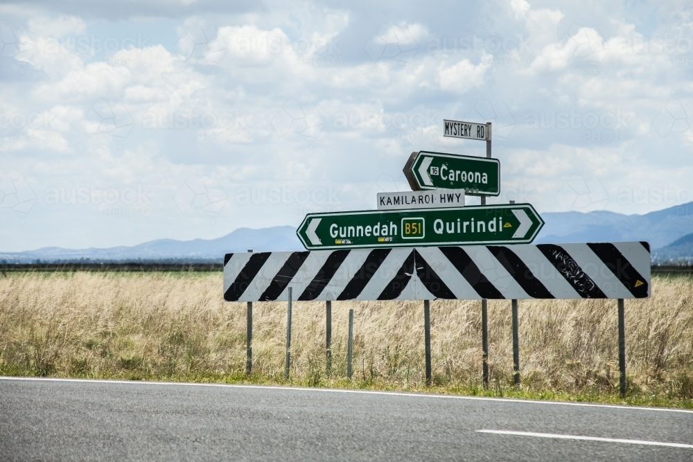Mystery Road direction sign to Caroona, Gunnedah and Quirindi on Kamilaroi Highway - Australian Stock Image