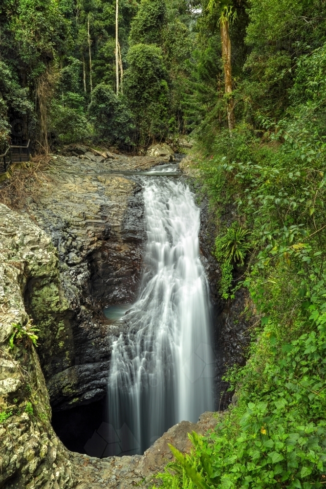 Natural Bridge waterfall in Springbrook National Park. - Australian Stock Image