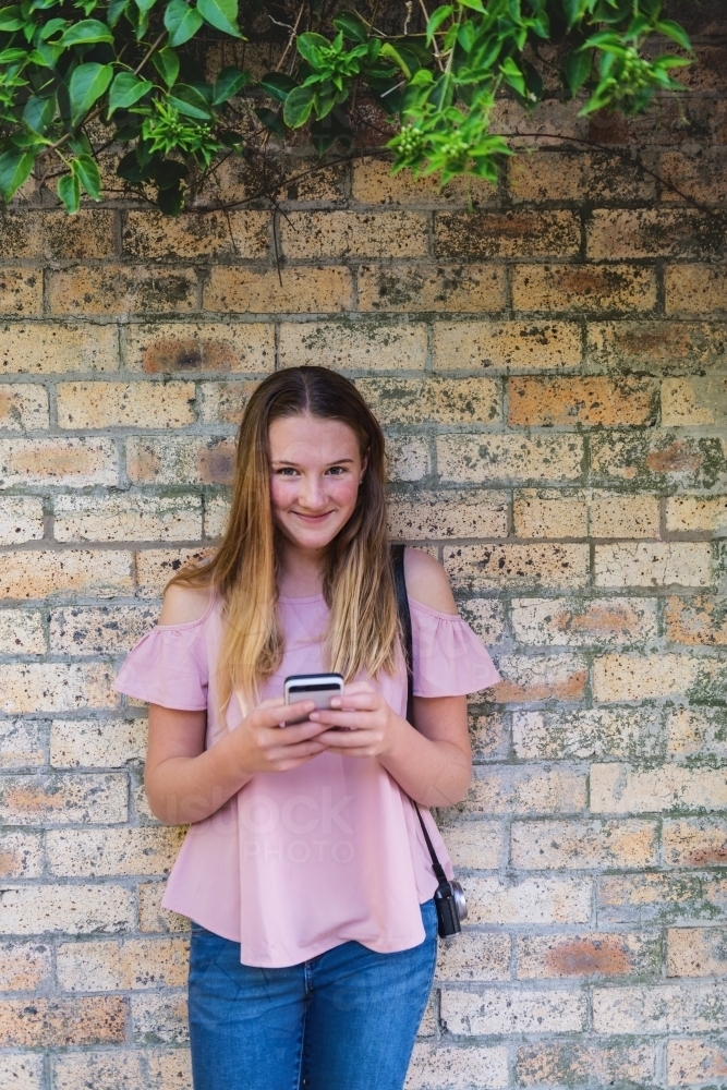 natural teen girl with mobile phone - Australian Stock Image