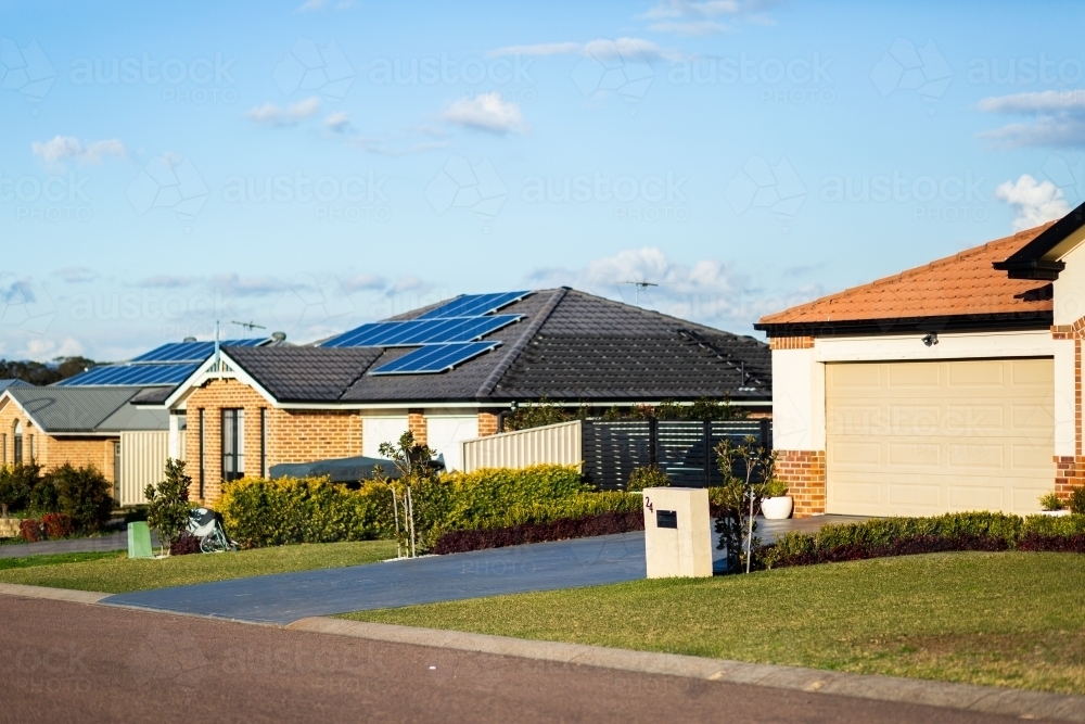 Neat houses along quiet suburban street in town - Australian Stock Image