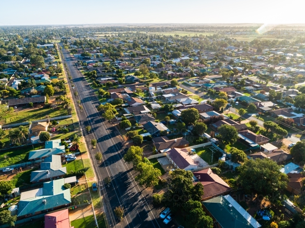 Neat houses along street of small country town of Narromine in morning light - Australian Stock Image