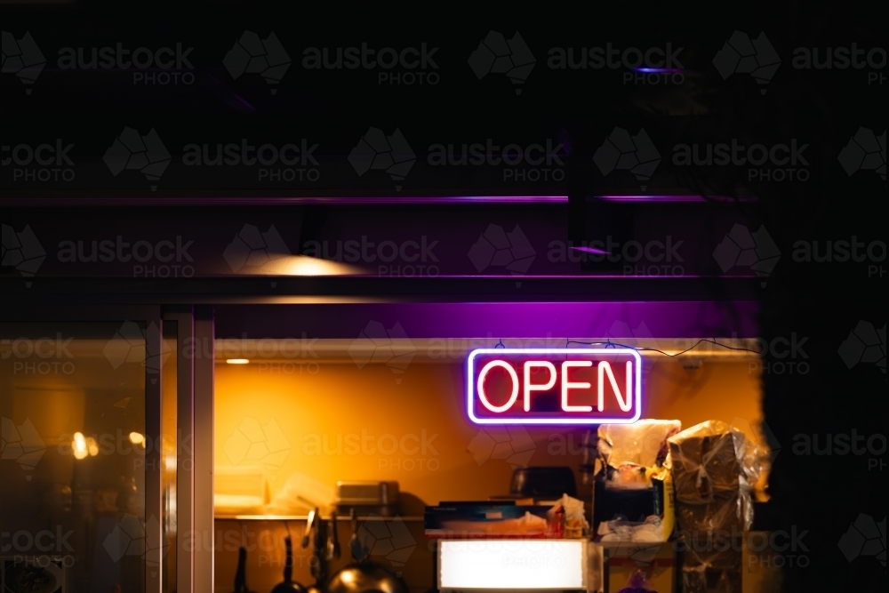 Neon open sign illuminated at take away noodle bar - Australian Stock Image