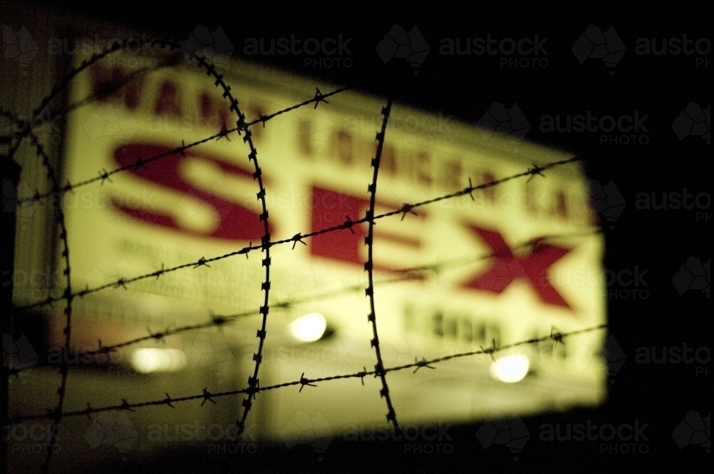 Neon sign and barbwire - Australian Stock Image