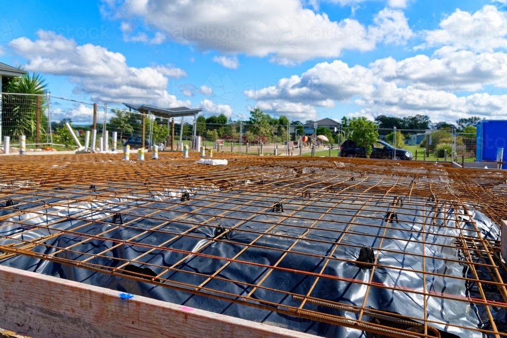 New construction site with groundwork and iron mesh laid - Australian Stock Image