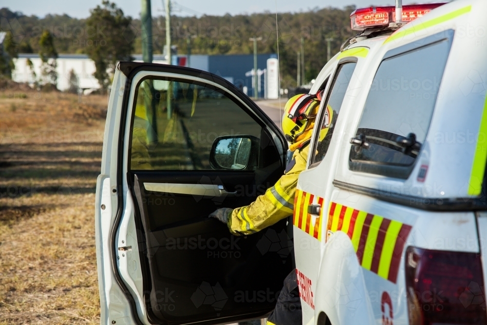 New South Wales fire service person getting into vehicle - Australian Stock Image