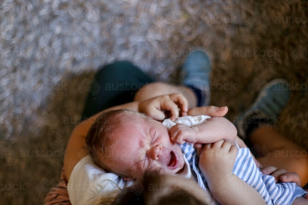 Newborn baby yawning - Australian Stock Image