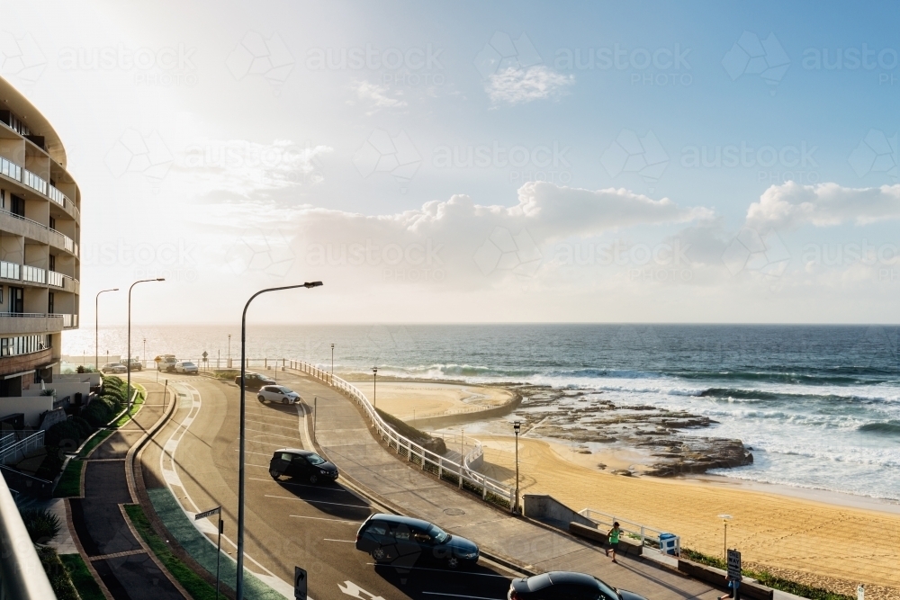 Newcastle beach at sunrise from a balcony - Australian Stock Image