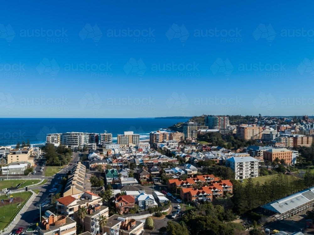Image of Newcastle East city apartment buildings with blue ocean behind