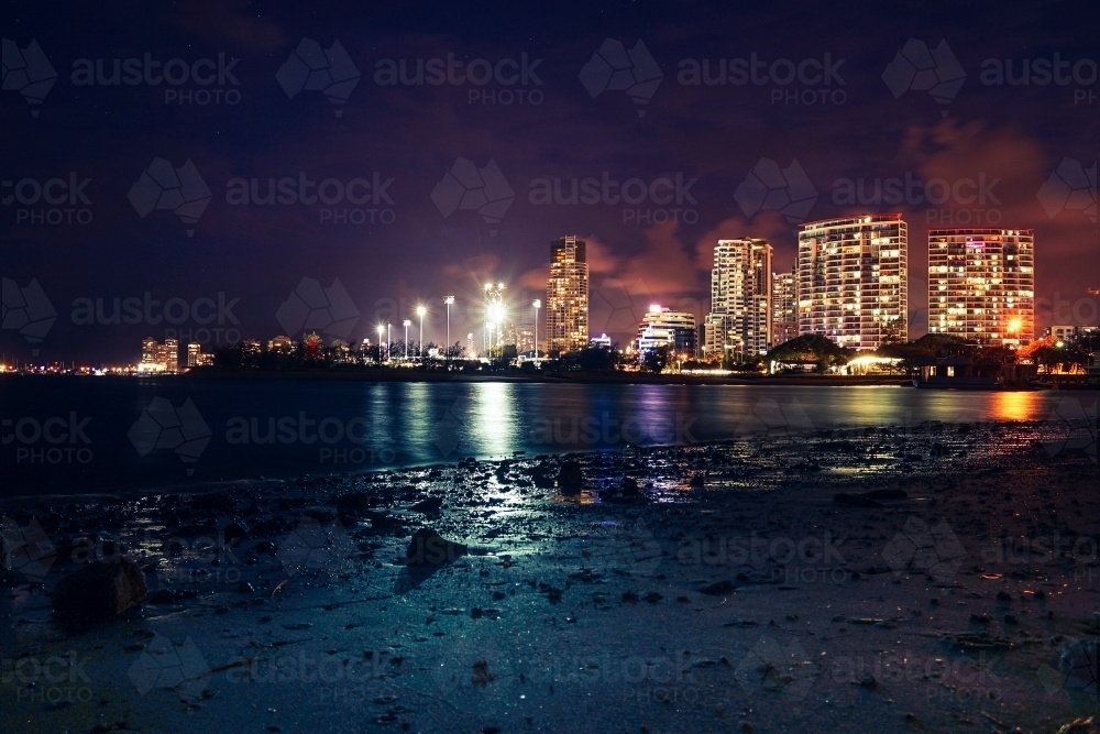 Night shot of buildings over water - Australian Stock Image