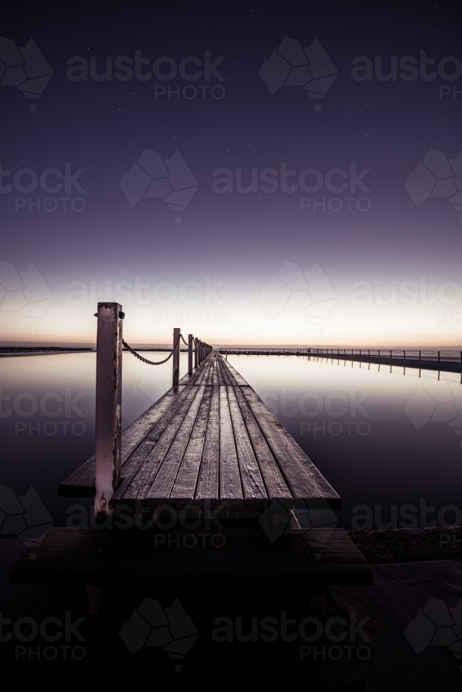Night time at Narrabeen Rock Pool on Sydney's Northern Beaches - Australian Stock Image