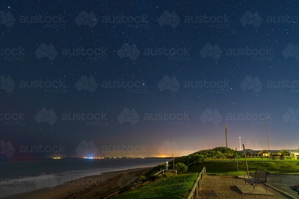 Night time scene of a coastal lookout a starry sky above - Australian Stock Image