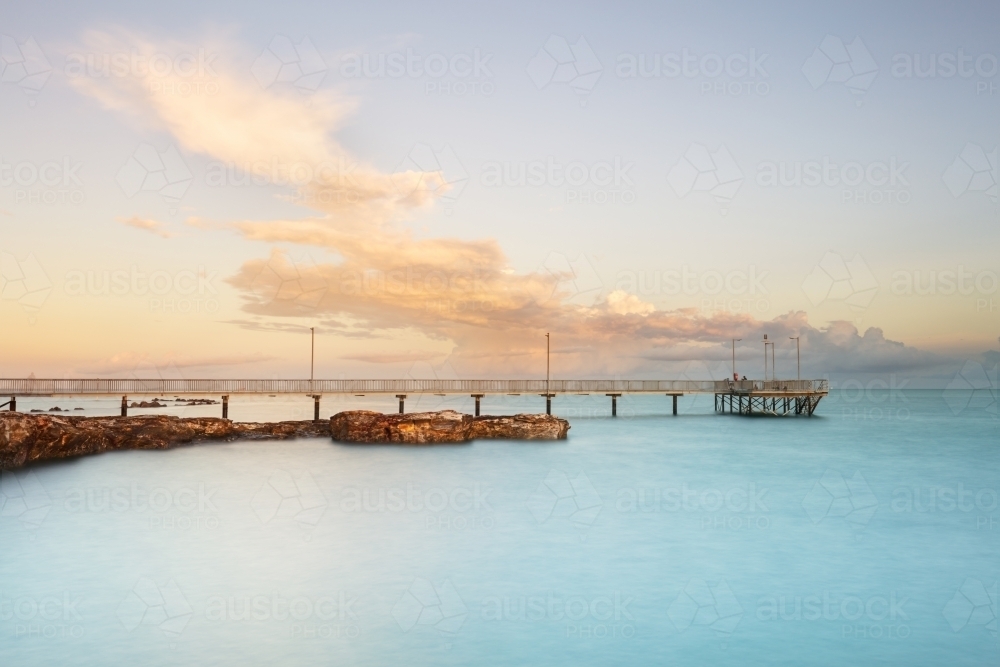 Nightcliff Jetty in morning light, pier with clouds in Darwin - Australian Stock Image