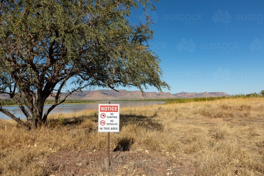 no camping and no vehicles on sign near river in the kimberley - Australian Stock Image
