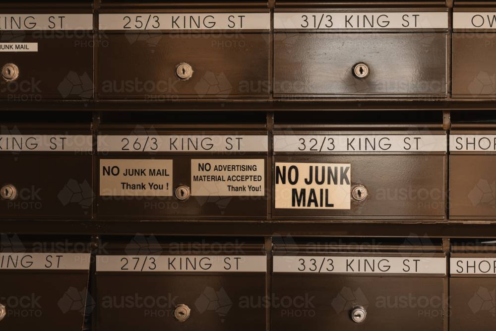 No junk mail signs on apartment building letter boxes - Australian Stock Image
