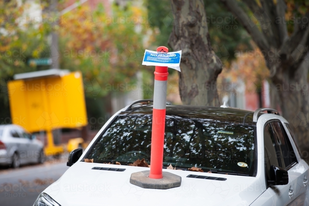 No parking sign on the bonnet of a car - Australian Stock Image