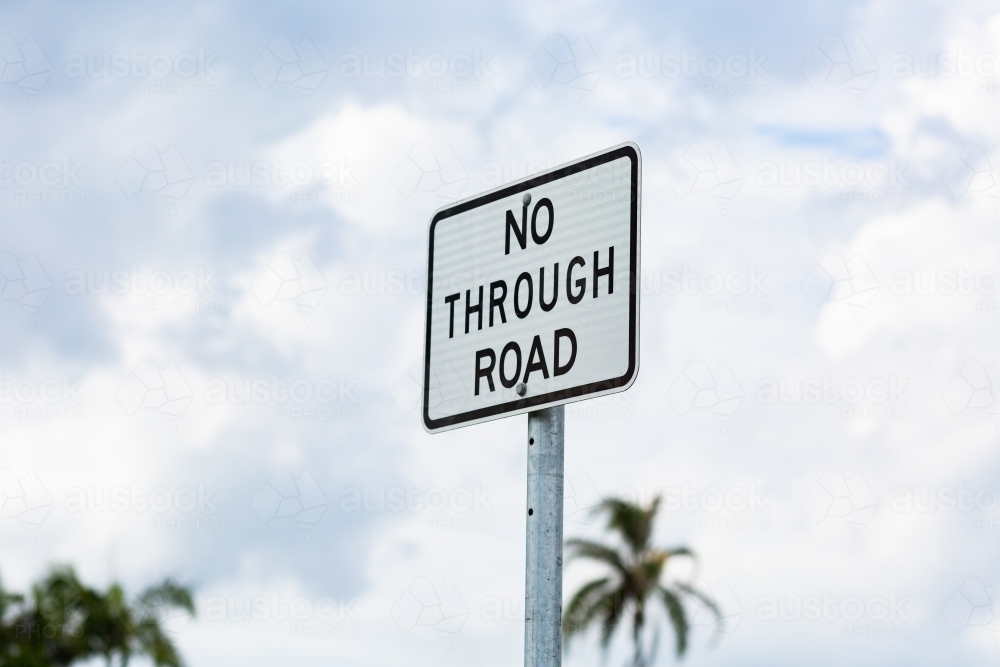 No Through road sign with palm trees in background - Australian Stock Image