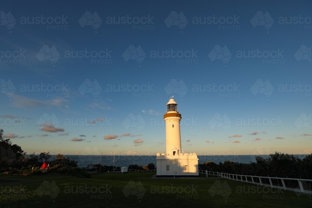 Norah Head Lighthouse on the New South Wales central coast in Australia at sunset - Australian Stock Image