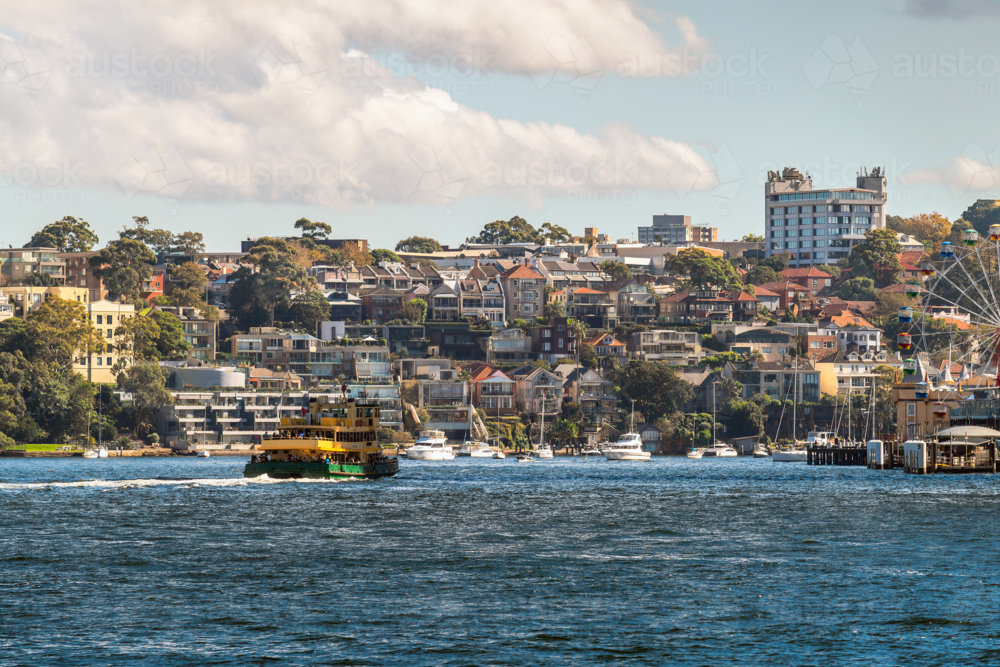 North Sydney skyline viewed from ferry departing from Circular Quay on a day - Australian Stock Image