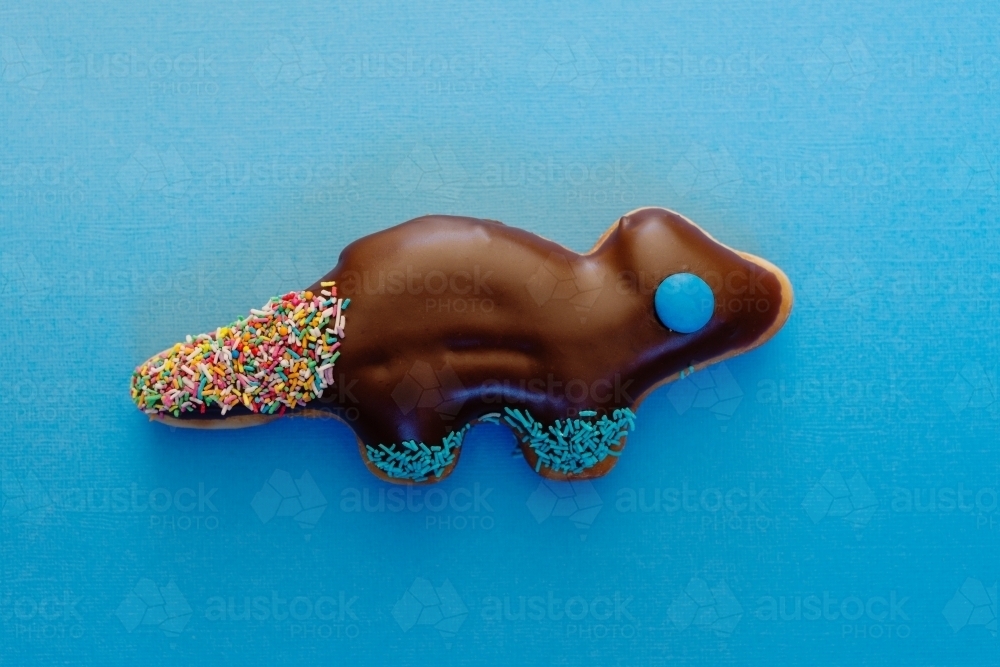 novelty donut in the shape of a dinosaur - Australian Stock Image