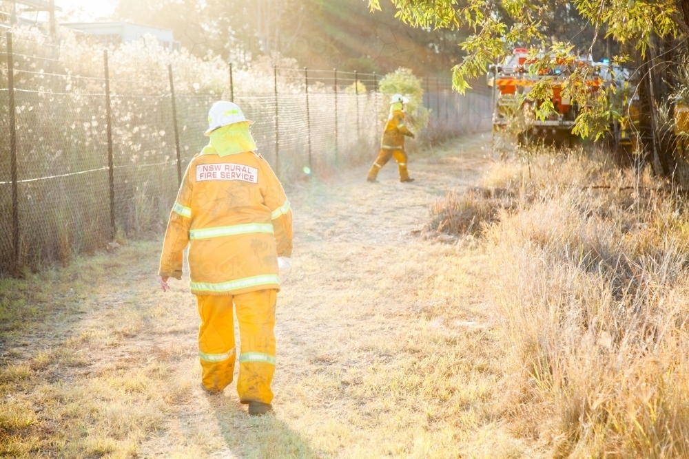 Image of NSW rural fire service volunteer firefighter walking to grass ...