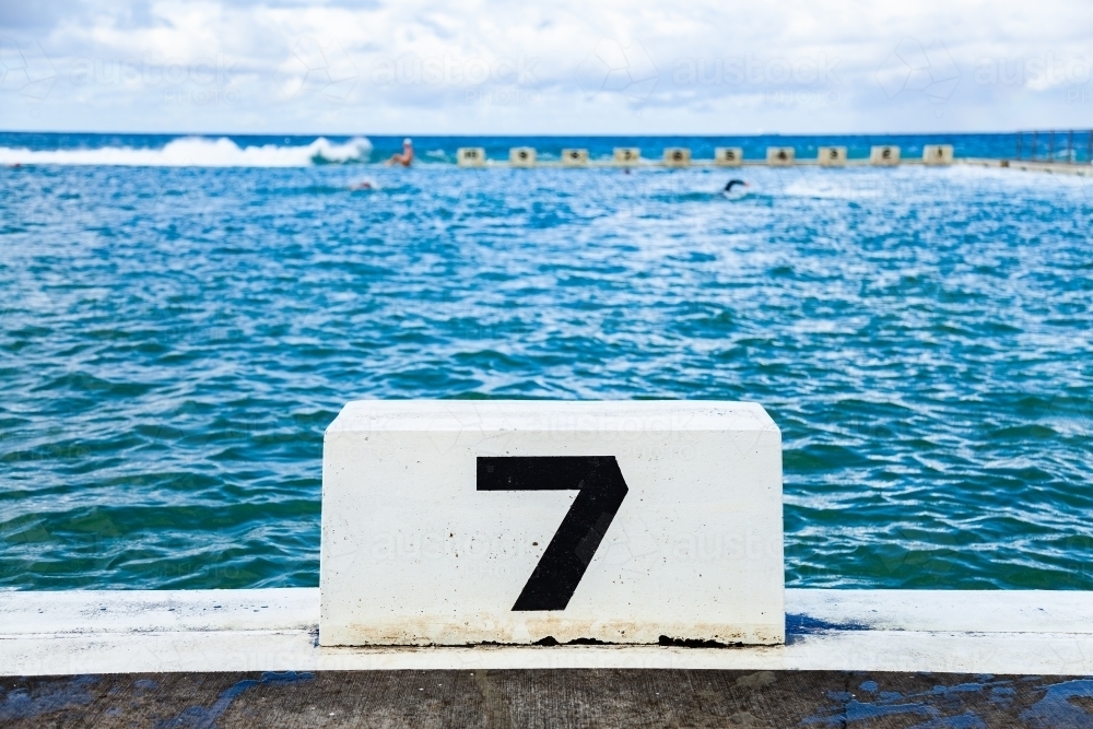 Number seven 7 swimming lane in ocean sea pool - Australian Stock Image