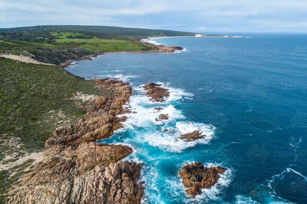 Oblique aerial view of cliffs, islands, coastline, and ocean. - Australian Stock Image