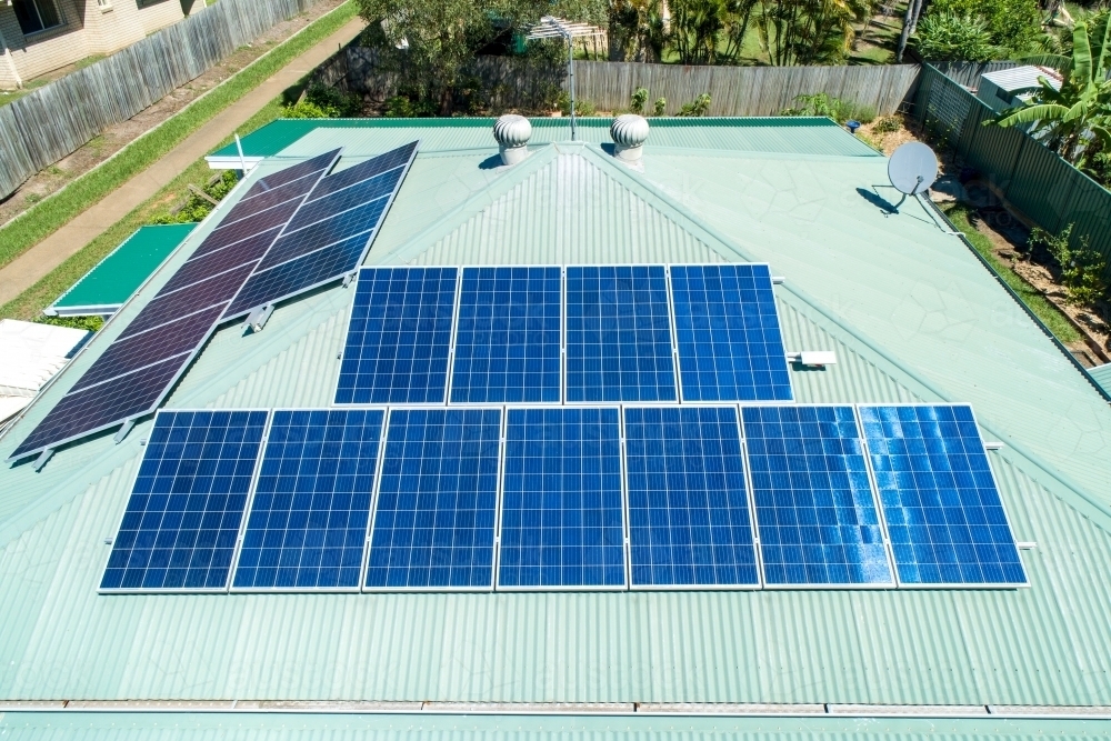 Oblique view of solar panels on metal roof. - Australian Stock Image