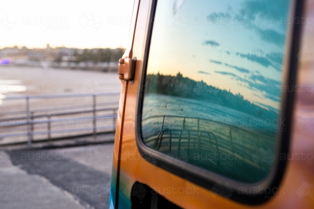 Ocean and sky reflection from van window at Bondi Beach - Australian Stock Image