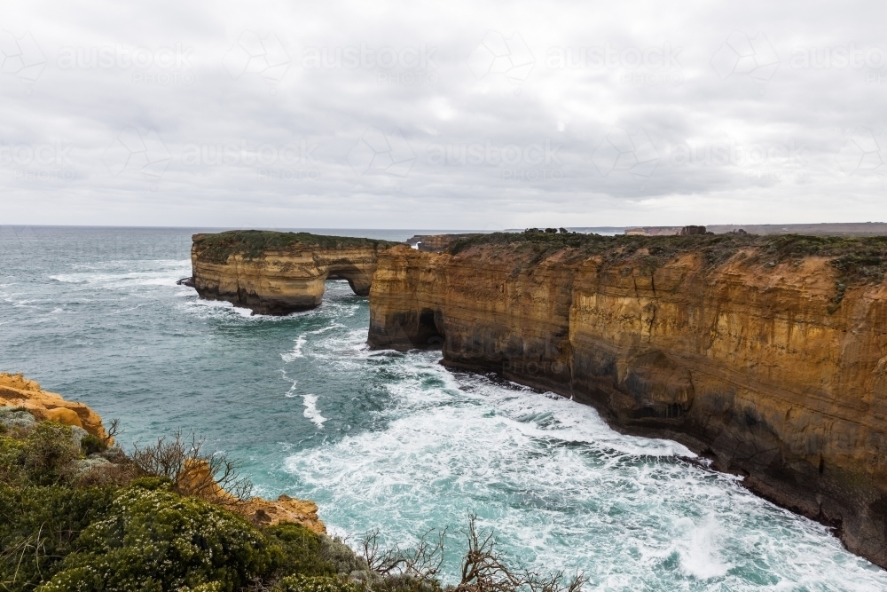 Ocean hitting rocks on the Great Ocean Road - Australian Stock Image