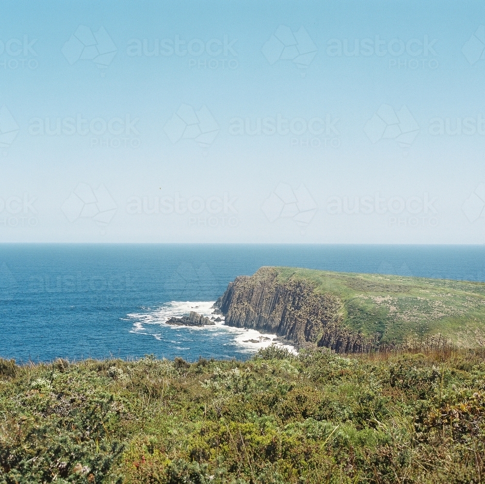 Ocean Landscape with Green Rocky Headland - Australian Stock Image