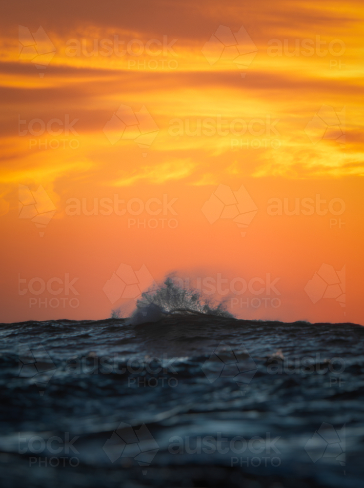 Ocean wave at sunrise - Australian Stock Image