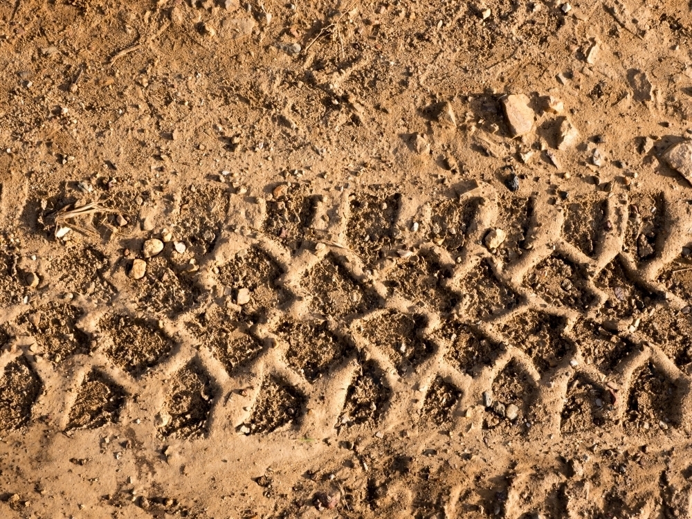 Off road tyre pattern in brown soil - Australian Stock Image