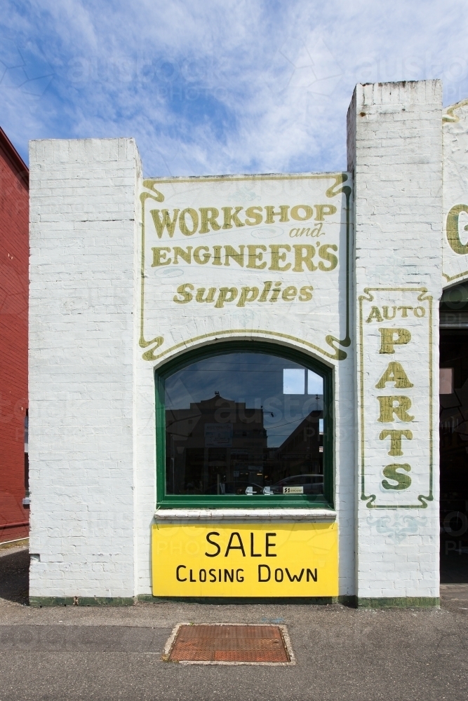 Old building with closing down sign - Australian Stock Image
