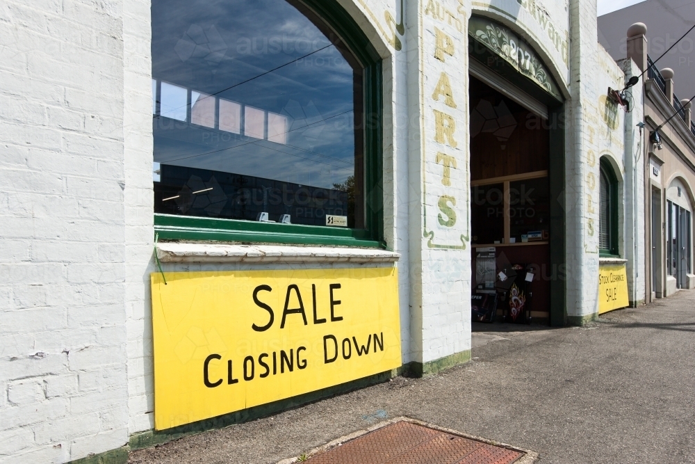 Old building with closing down sign - Australian Stock Image