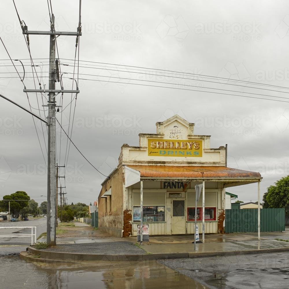 Old corner shop and signage after rain - Australian Stock Image
