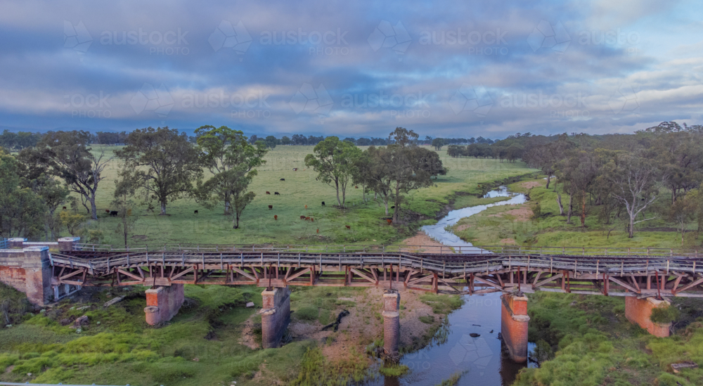 Old country railway bridge over a creek - Australian Stock Image