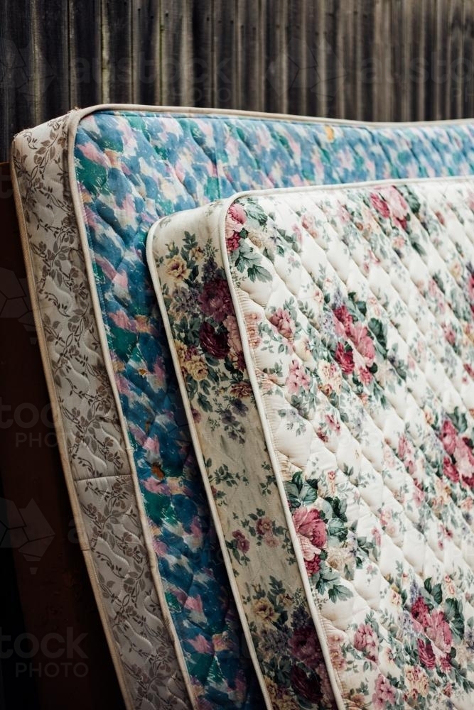 Old discarded mattresses on street - Australian Stock Image