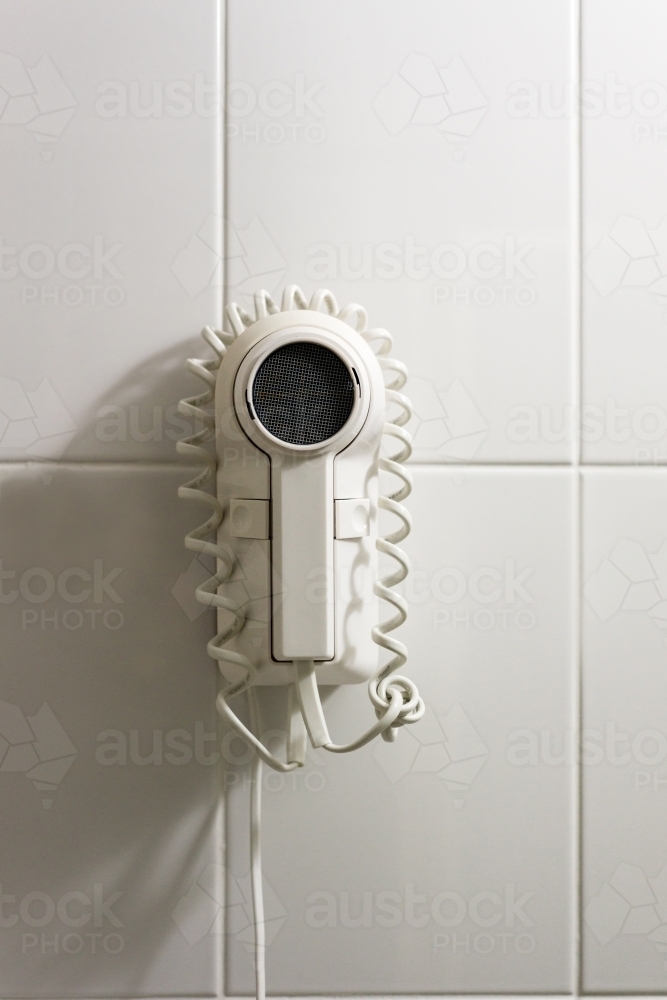 old fashioned hair dryer in cheap motel - Australian Stock Image