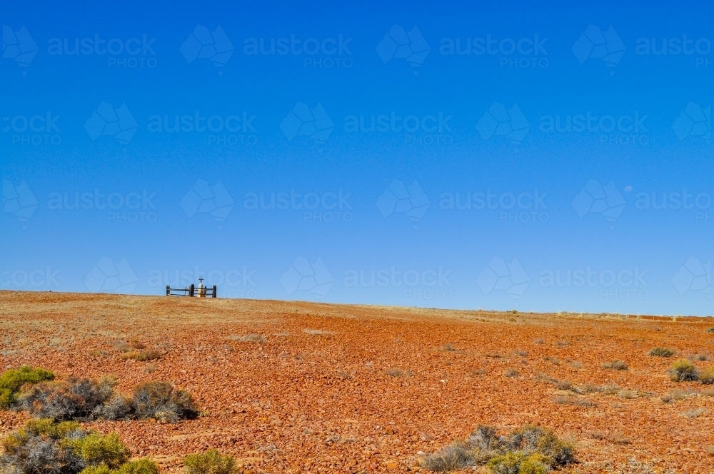 Old grave on a hill in the desert - Australian Stock Image
