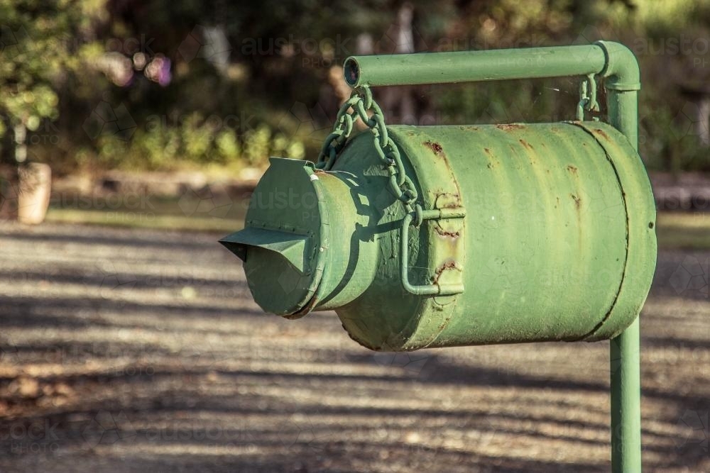 Old green milk can mailbox - Australian Stock Image