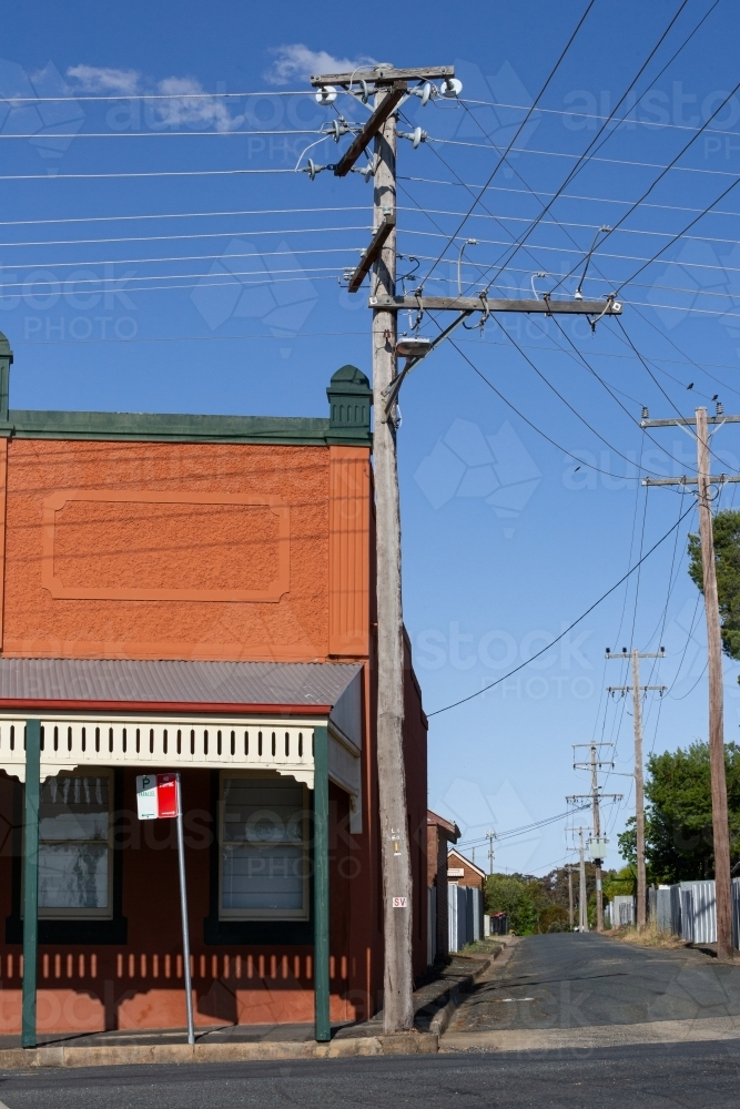 old historic building with verandah and power pole in grenfell - Australian Stock Image