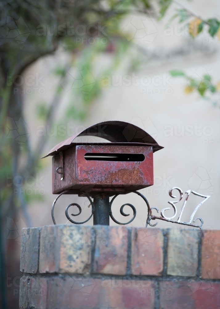 Old letterbox and house number - Australian Stock Image