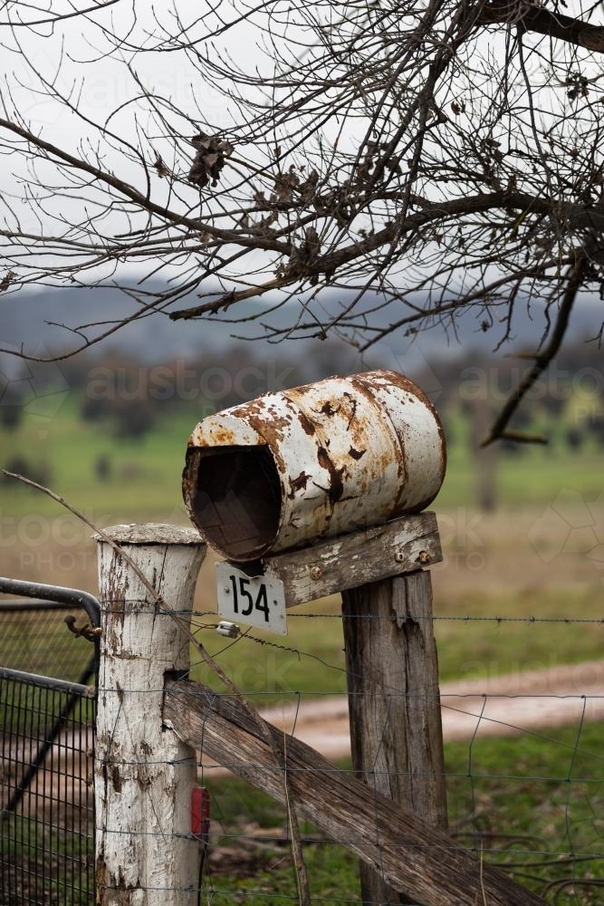 Old letterbox near gate on remote farm - Australian Stock Image