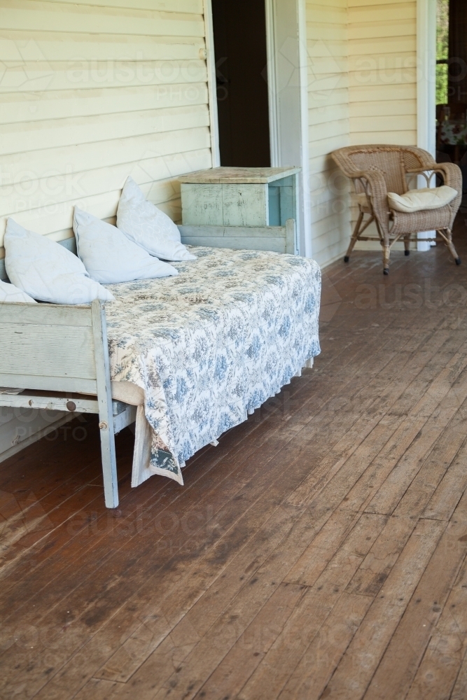Old lounge on an enclosed verandah of a country homestead - Australian Stock Image