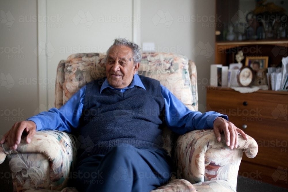 Old man resting in lounge chair - Australian Stock Image
