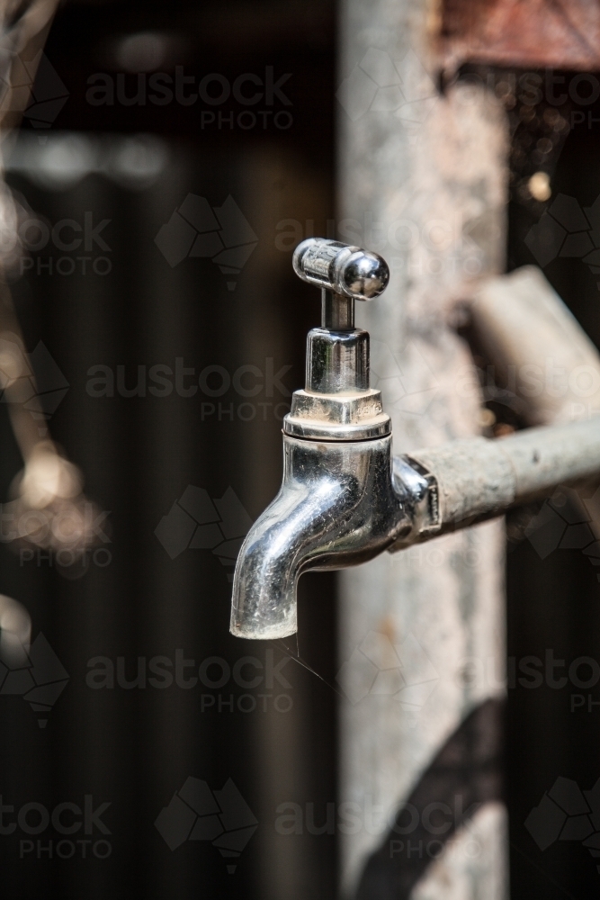Old metal tank tap outside - Australian Stock Image