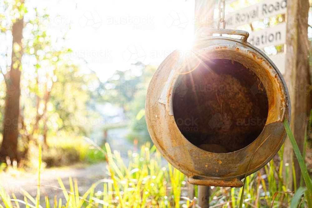 Old milk can as country mailbox at property entrance - Australian Stock Image