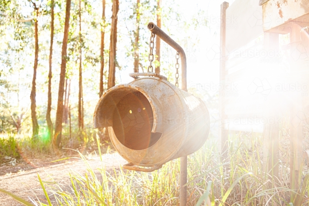 Old milk can as country mailbox at property entrance - Australian Stock Image