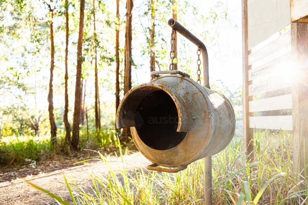 Old milk can as country mailbox at property entrance - Australian Stock Image