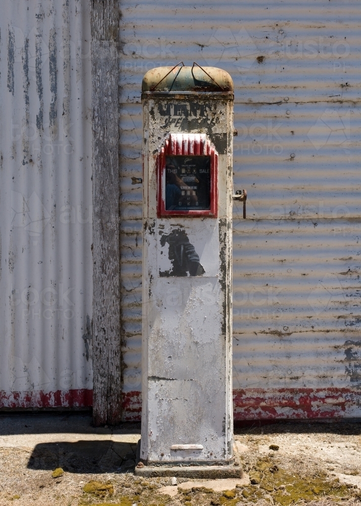 old petrol bowser in front of a corrugated iron shed - Australian Stock Image